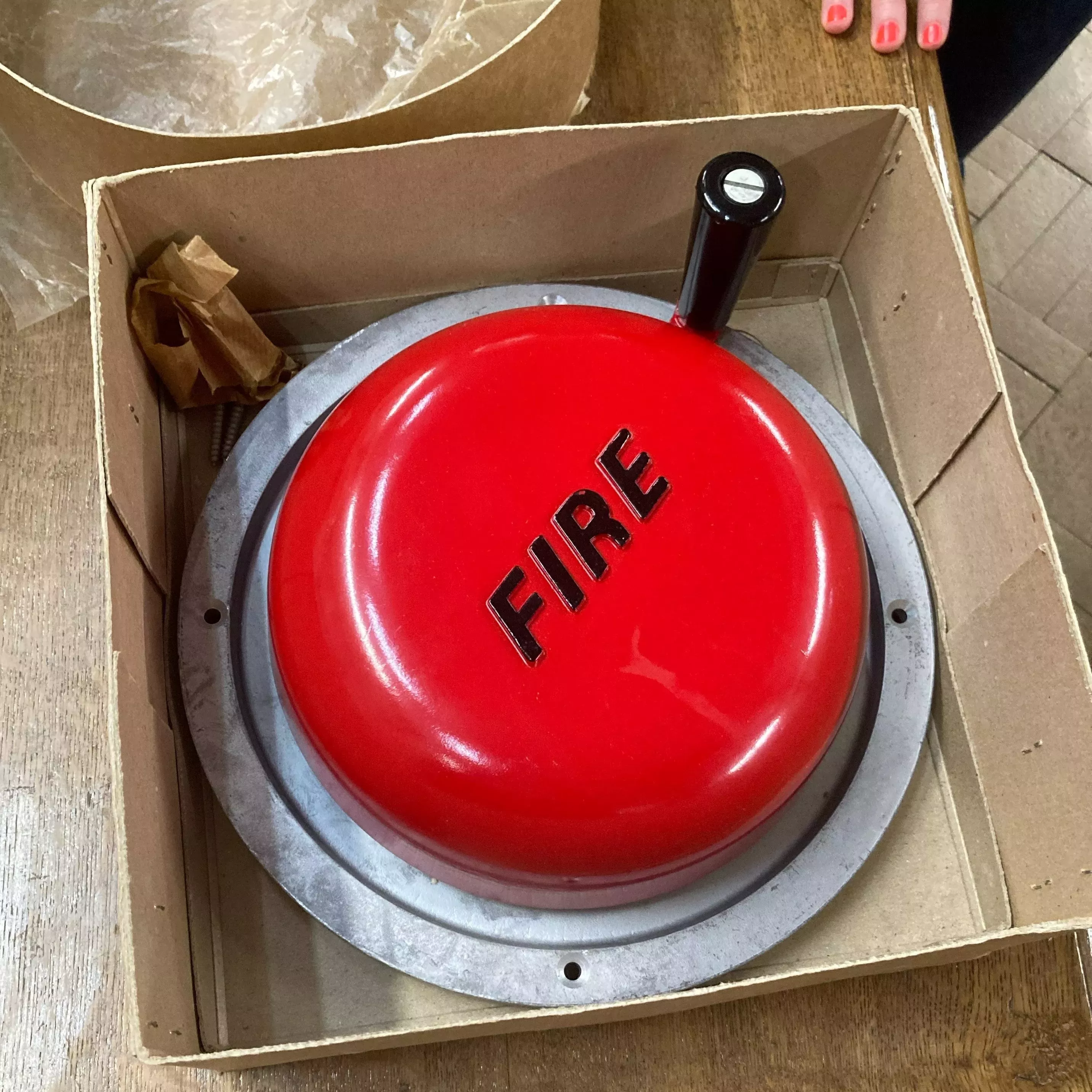 This spare retro fire alarm was never needed and remained in Herbarium storage for likely more than half a century © Chiara Seed, RBG Kew An old style fire alarm in a box