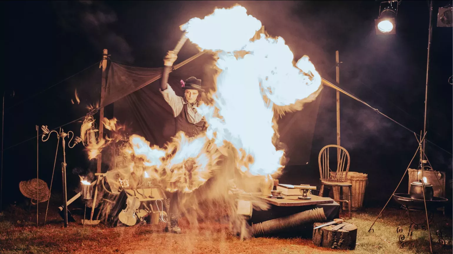 Halloween at Kew © RGLiveSony Music A person in front of a tent throwing fire around