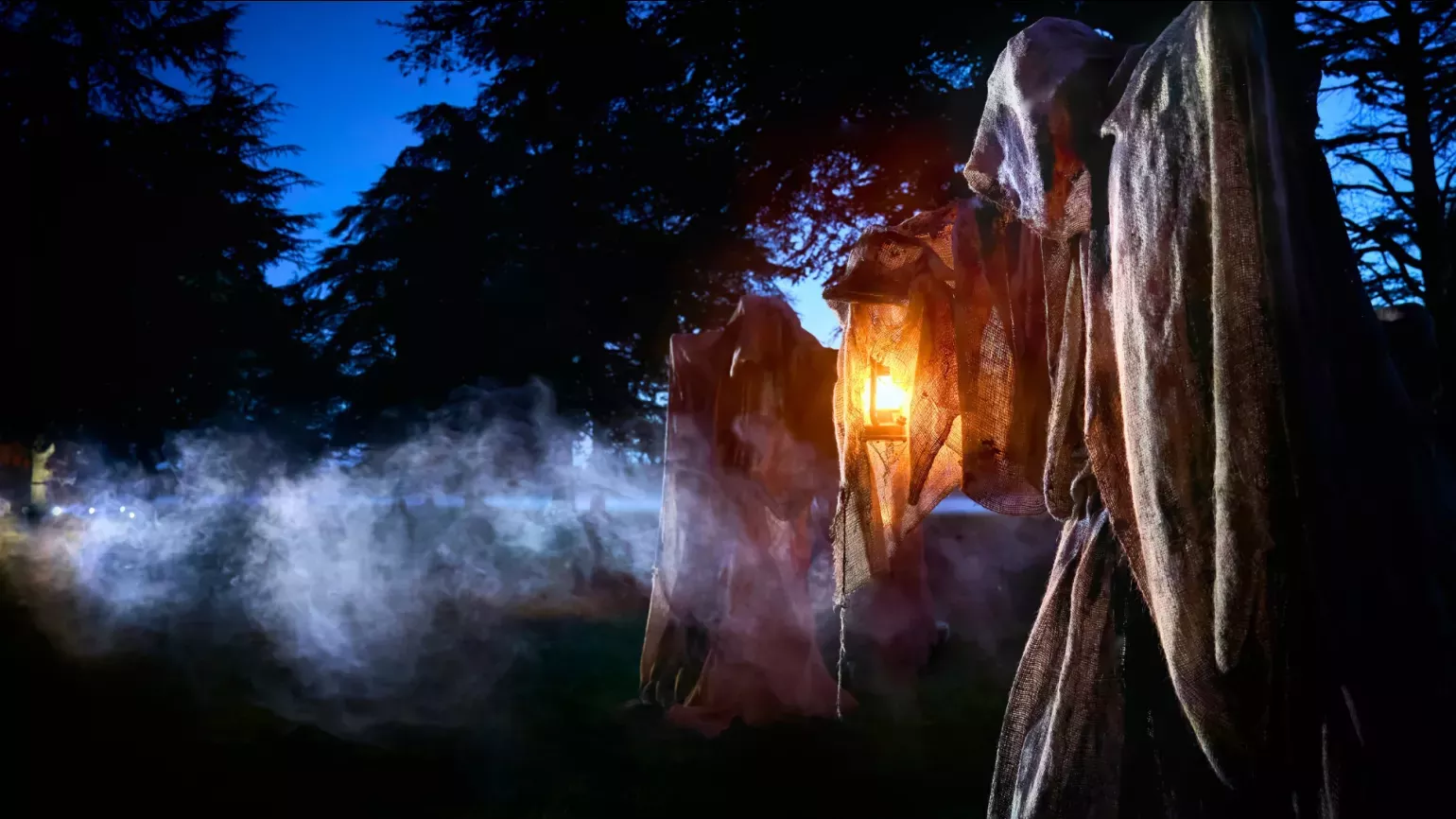 Halloween at Kew © RGLiveSony Music A wraith covered in cloth and holding a lantern in a misty forest